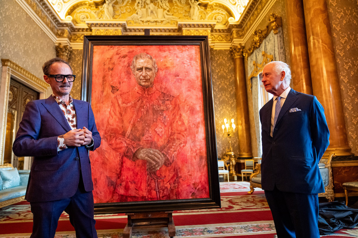 Artist Jonathan Yeo and King Charles III at the unveiling of artist Yeo's portrait of the King, in the blue drawing room at Buckingham Palace, London. The portrait was commissioned in 2020 to celebrate the then Prince of Wales's 50 years as a member of The Drapers' Company in 2022. The artwork depicts the King wearing the uniform of the Welsh Guards, of which he was made Regimental Colonel in 1975. The canvas size - approximately 8.5 by 6.5 feet when framed - was carefully considered to fit within the architecture of Drapers' Hall and the context of the paintings it will eventually hang alongside.  Picture date: Tuesday May 14, 2024. PA Photo. Jonathan Yeo had four sittings with the King, beginning when he was Prince of Wales in June 2021 at Highgrove, and later at Clarence House. The last sitting took place in November 2023 at Clarence House. Yeo also worked from drawings and photographs he took, allowing him to work on the portrait in his London studio between sittings. See PA story ROYAL King. Photo credit should read: Aaron Chown/PA Wire