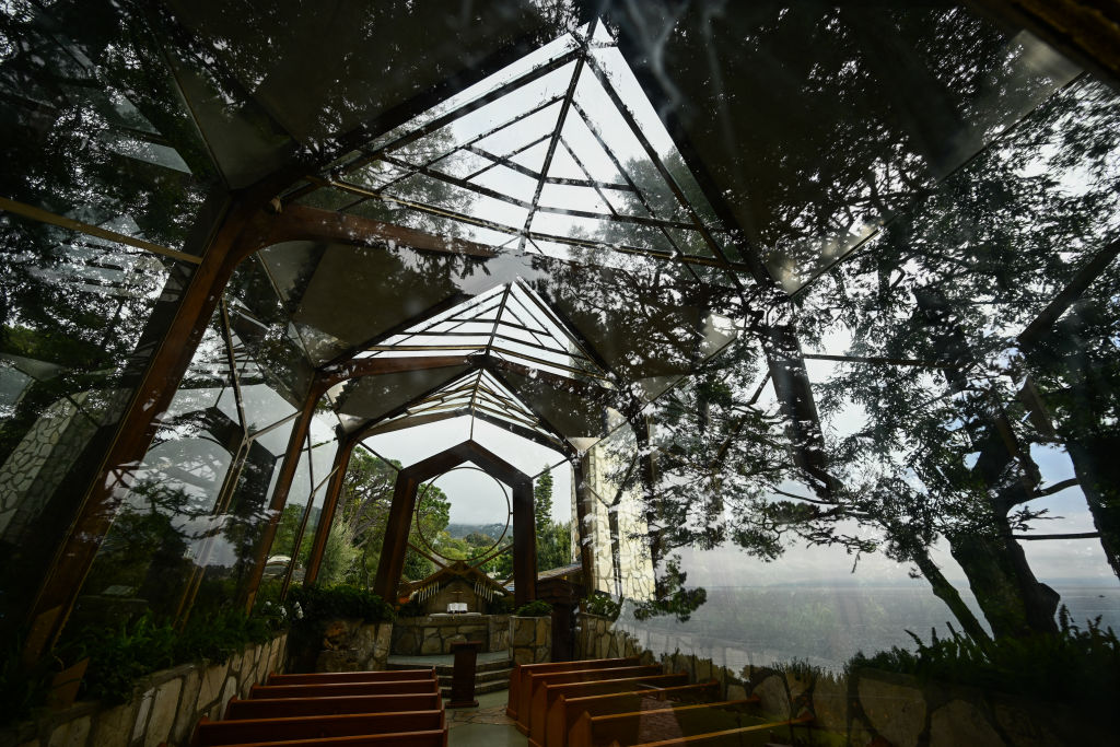 The Wayfarers Chapel in a landslide prone area following its closure due to land movement after heavy rains in Rancho Palos Verdes, California on February 16, 2024. The church, designed by Lloyd Wright, son of Frank Lloyd Wright, features glass walls and a connection to coastal nature of the Pacific Ocean. The National Historic Landmark overlooks Abalone Cove, a landslide complex on the Palos Verdes Peninsula, has had at least seven panes of glass break in the last year according to Rev. Dan Burchett, as well as sidewalks and roadways shifting from land movement as work continues to protect the structure from water, debris flows, and improve drainage. (Photo by Patrick T. Fallon / AFP) (Photo by PATRICK T. FALLON/AFP via Getty Images)